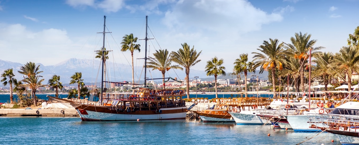 Port with sightseeing boats, beautiful scenery, Resort town Side in Turkey